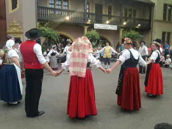 Folklore dancing in the evening at Colmar, Alsace (France)